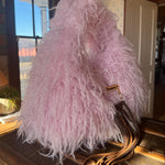 Pink Gucci Softbit Shearling handbag with a gold clasp on a wooden surface with Leather finge. Leather and Vodka, LAV