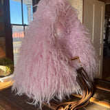 Pink Gucci Softbit Shearling handbag with a gold clasp on a wooden surface with Leather finge. Leather and Vodka, LAV