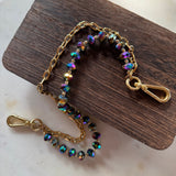 Jewelry with beads and chain on a wooden and marble surface