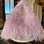 Pink Gucci Softbit Shearling handbag with a gold clasp on a wooden surface with Leather finge. Leather and Vodka, LAV