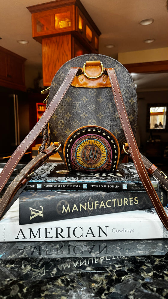 LAV Original Ellipse Backpack Chocolate Zipper Pulls with Western Skies Tooled Patch
