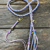 Iridescent Mermaid Bag Strap, made with braided leather with matching snap on key chain, laying on wooden table. 