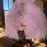 Pink Gucci Softbit Shearling handbag with a gold clasp on a wooden surface with Leather finge. Leather and Vodka, LAV