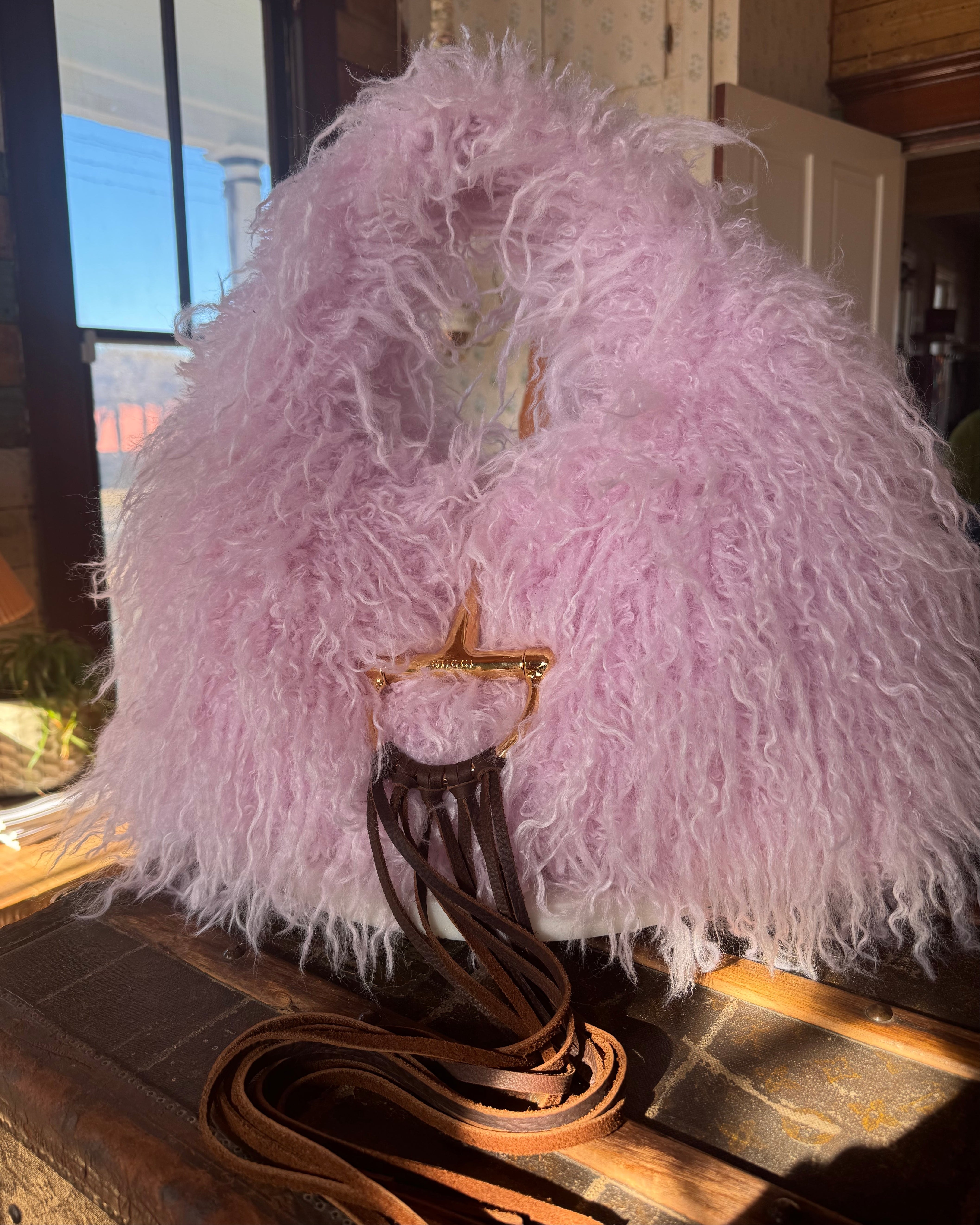 Pink Gucci Softbit Shearling handbag with a gold clasp on a wooden surface with Leather finge. Leather and Vodka, LAV