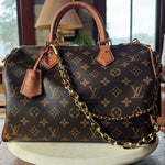 Luxury handbag with monogram pattern, revamped by Leather and Vodka with gold bag chain