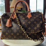 Luxury handbag with monogram pattern, revamped by Leather and Vodka with gold bag chain