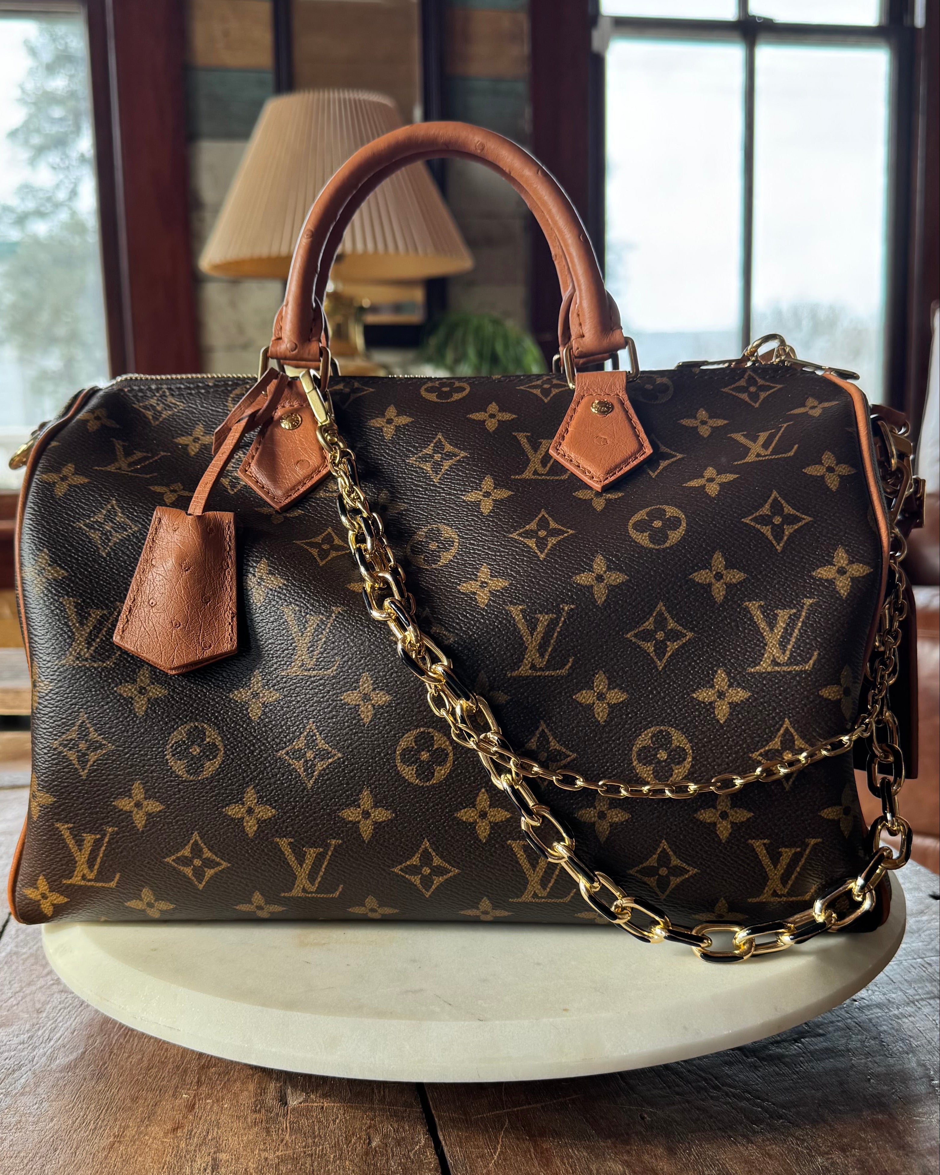 Luxury handbag with monogram pattern, revamped by Leather and Vodka with gold bag chain